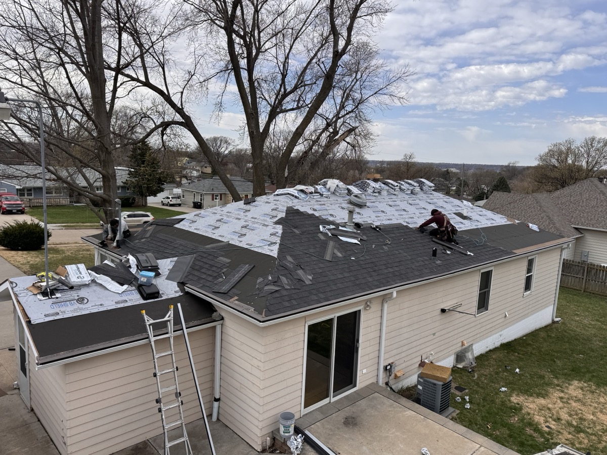 Quinonez Exteriors provides expert roofing installation for residential homes in Omaha. A newly installed asphalt shingle roof showcasing clean lines and professional workmanship.