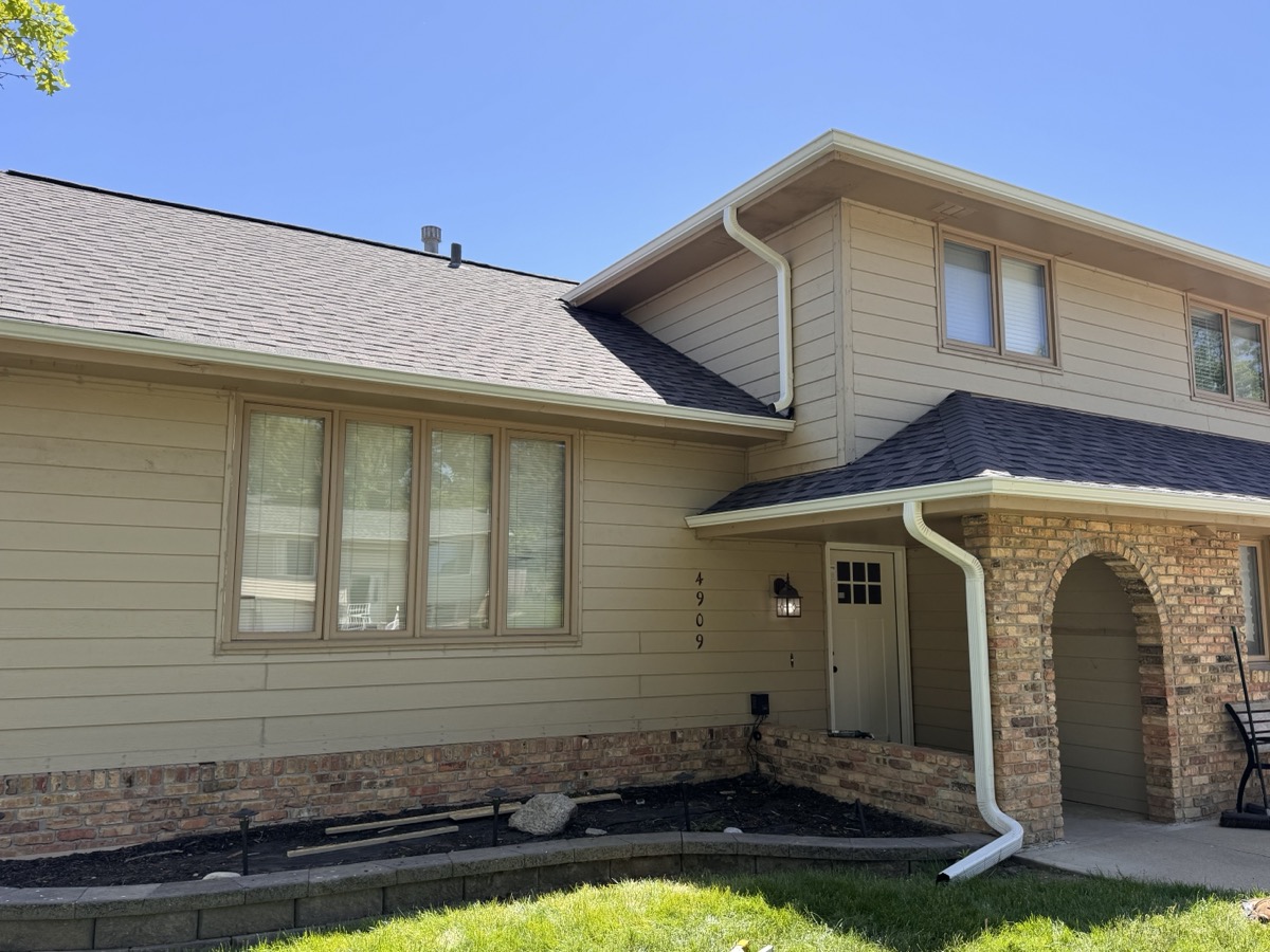 Premium siding materials provide decades of weather resistance and beauty. A close-up of newly installed siding showing precise alignment and trim work. width=